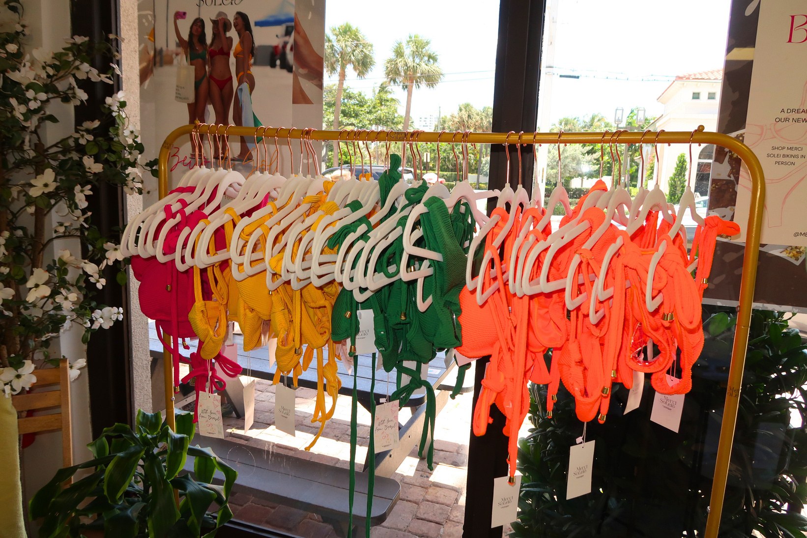 Merci Solei collection arranged on a clothing rail